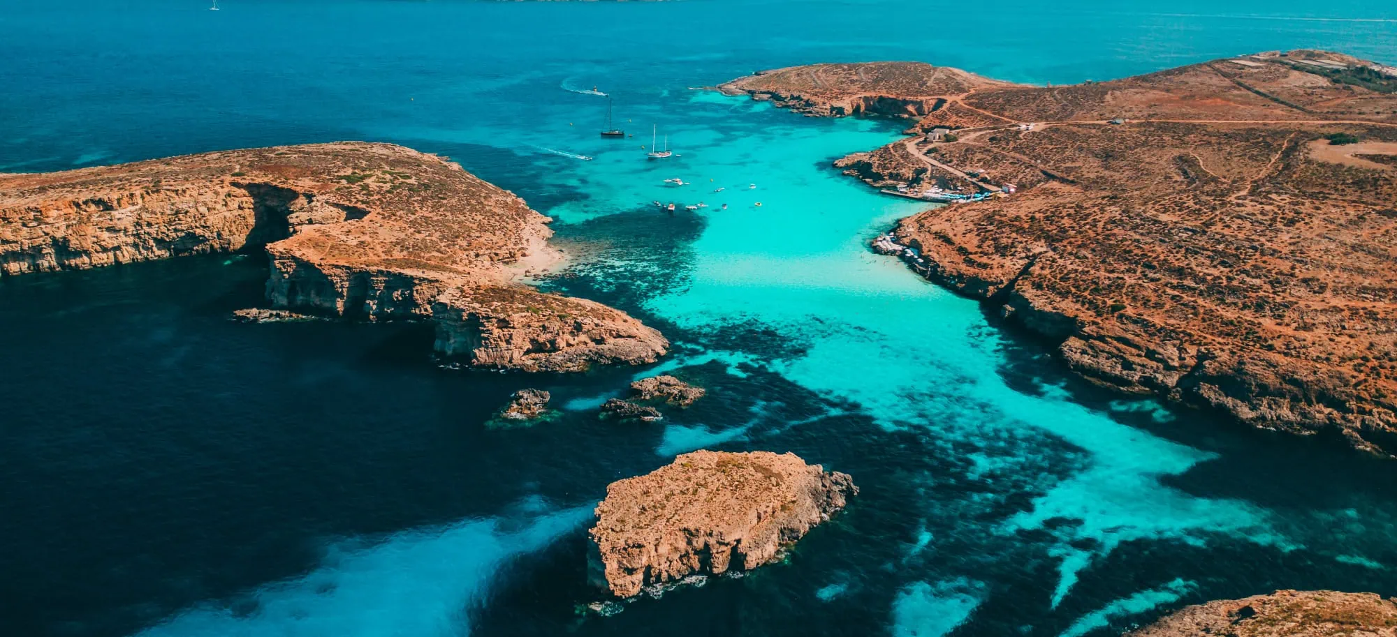 Comino Aerial View An aerial view of Comino, including the turquoise waters of the blue lagoon.