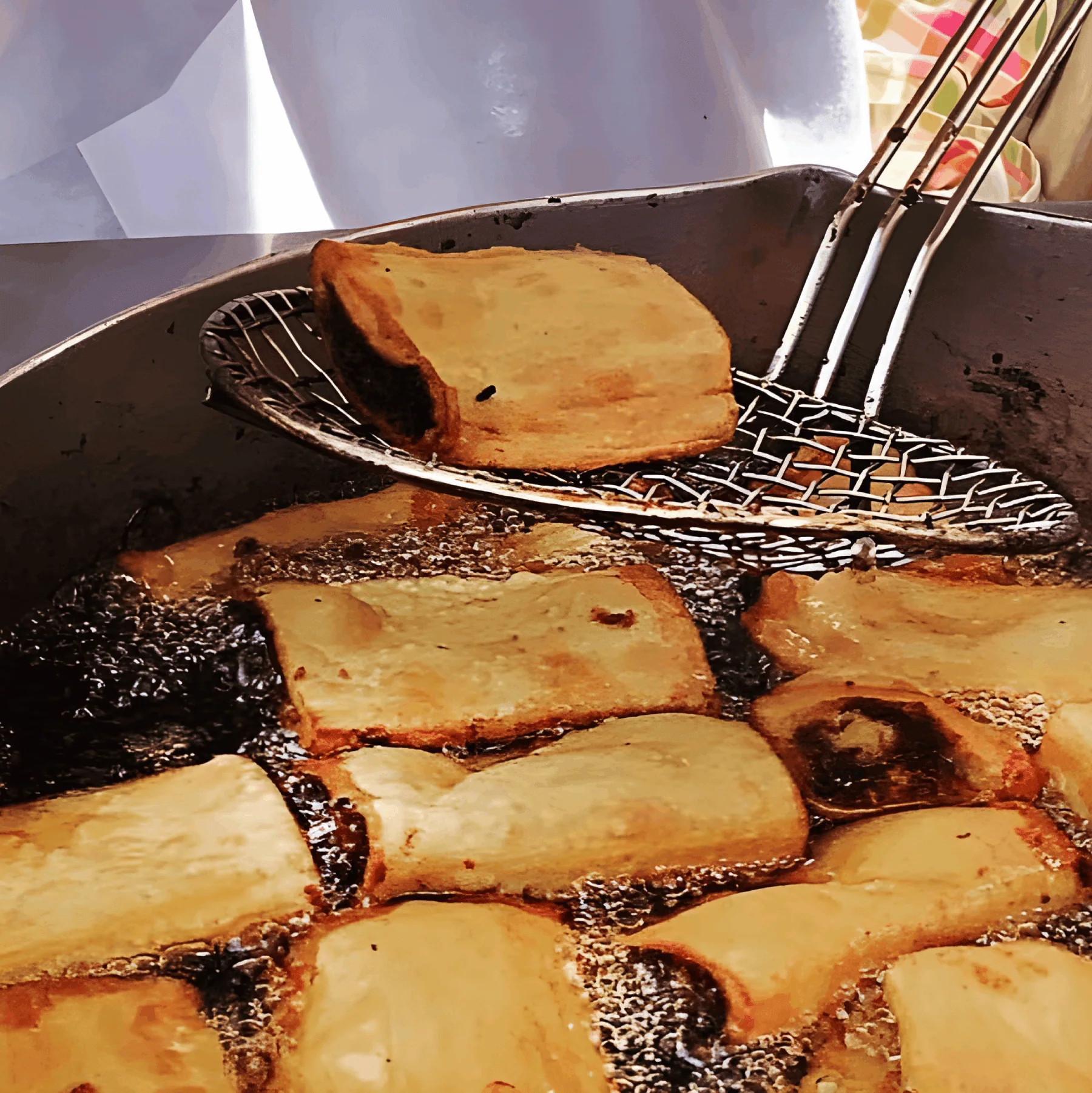 Kannoli During Festa Kannoli being freshly fried during a Maltese festa.